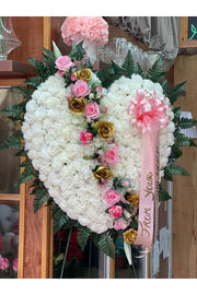 Artificial broken heart sympathy arrangement with white carnations, pink roses, and gold roses on easel stand by Eclore Floral NJ
