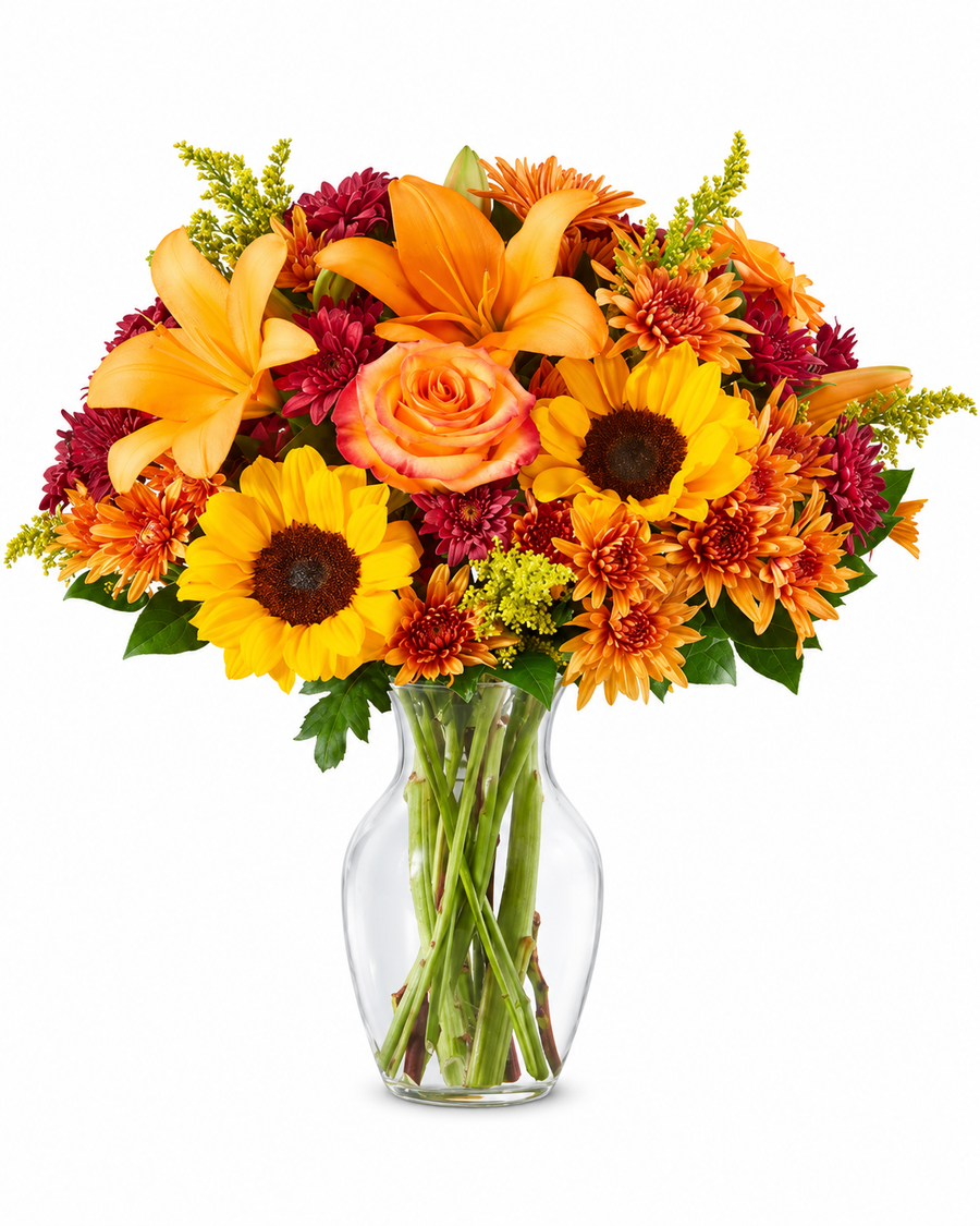 Autumn Sunshine fall flower bouquet with sunflowers, lilies and roses in a clear glass vase