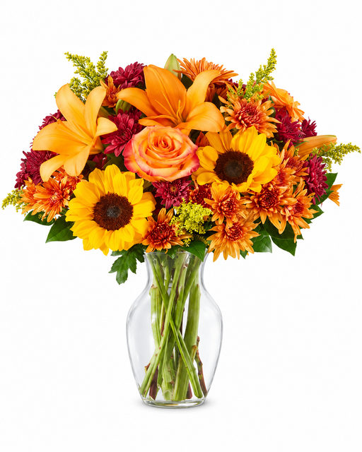 Autumn Sunshine fall flower bouquet with sunflowers, lilies and roses in a clear glass vase