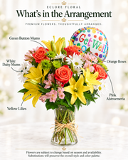 What's in the Arrangement: orange roses, yellow lilies, white daisy mums, green button mums and pink alstroemeria. Flowers are subject to season and availability; substitutions preserve the overall style and color palette.
