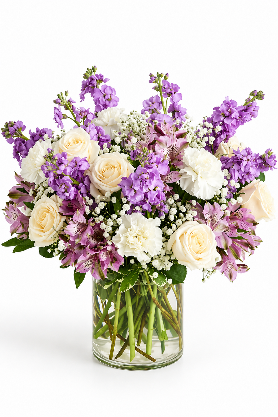 Lavender Grace purple and ivory rose arrangement in a clear glass vase