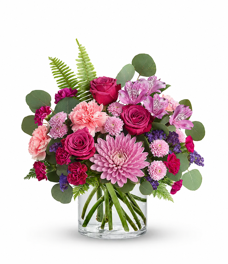 Pink Bloom Garden with roses, carnations, chrysanthemums and alstroemeria in clear glass vase
