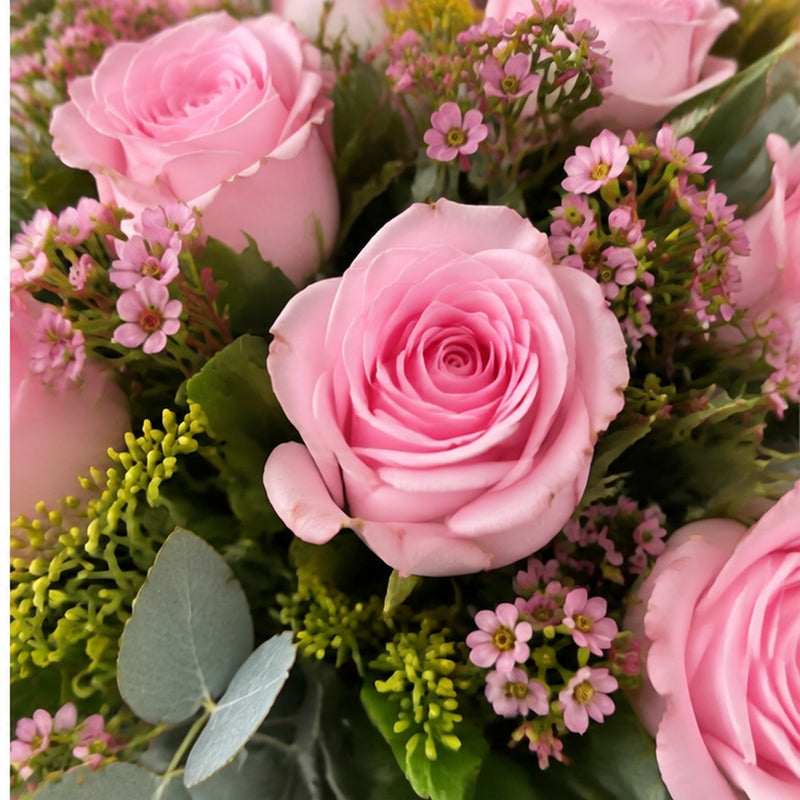 Close-up detail of pink roses in the Pink Bubble arrangement.