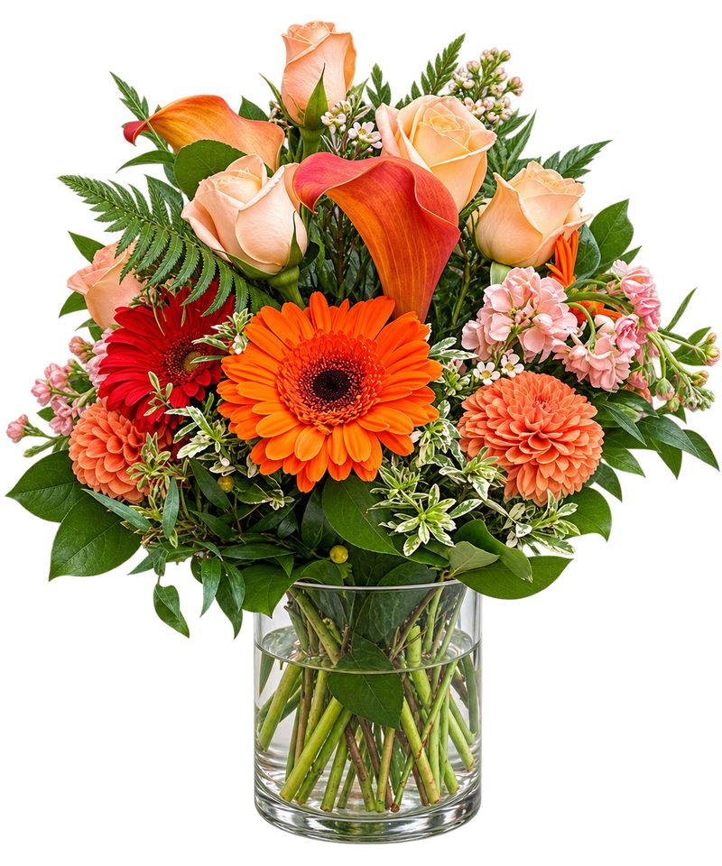 Rustic Flame orange flower arrangement with peach roses, orange gerbera daisies, calla lilies and dahlias in a clear glass vase