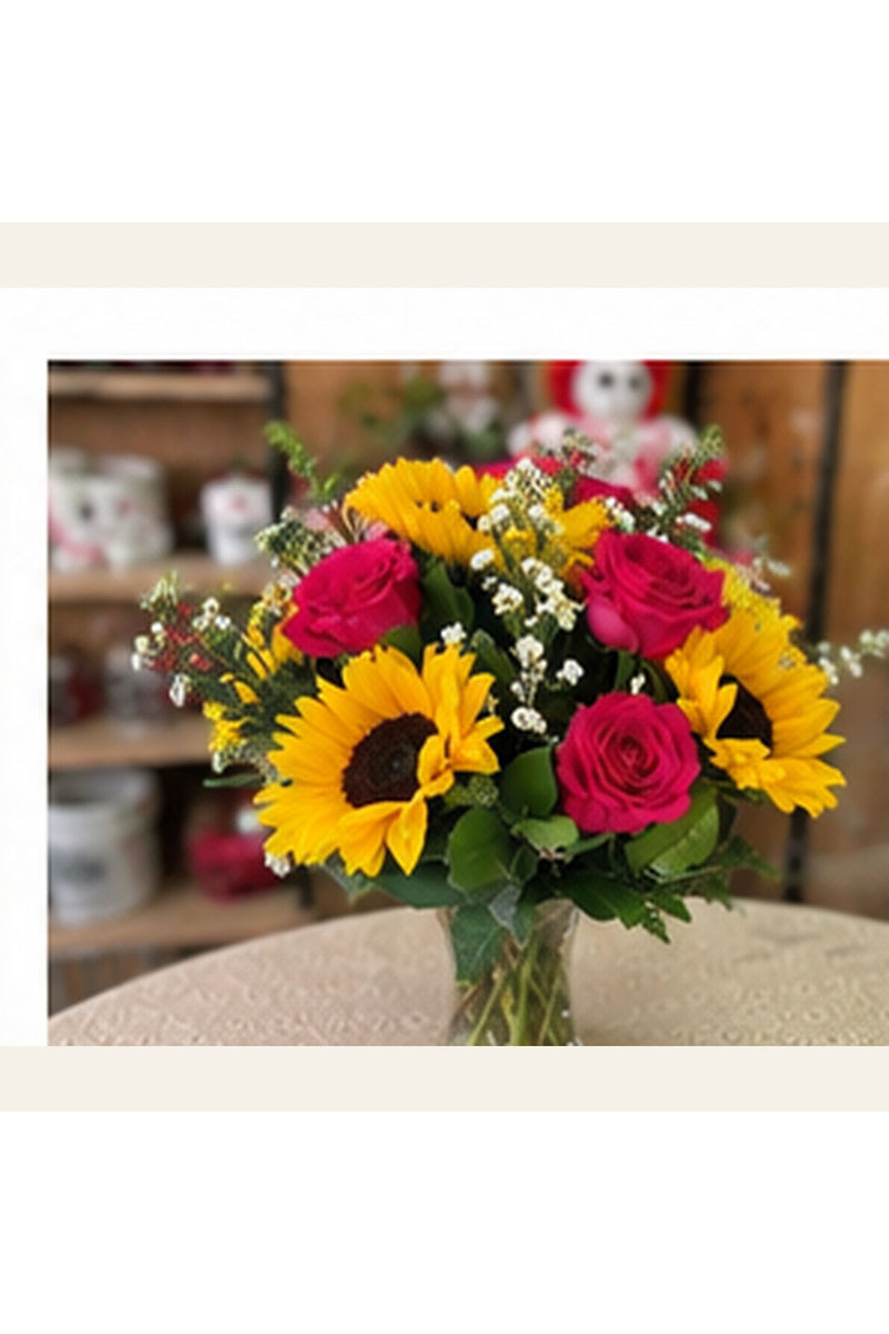 Sunshine Garden sunflower and rose arrangement shown from a natural three-quarter angle.