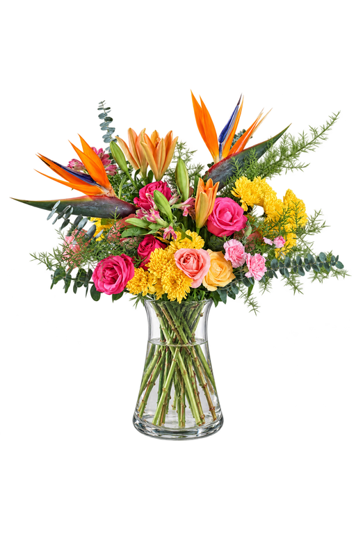 Tropical Radiance flower arrangement with Birds of Paradise, roses, lilies and yellow chrysanthemums in a clear glass vase