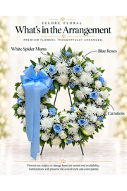 Eclore Floral — What’s in the Arrangement: White & Blue Sympathy Wreath. Flowers may vary with season and availability.