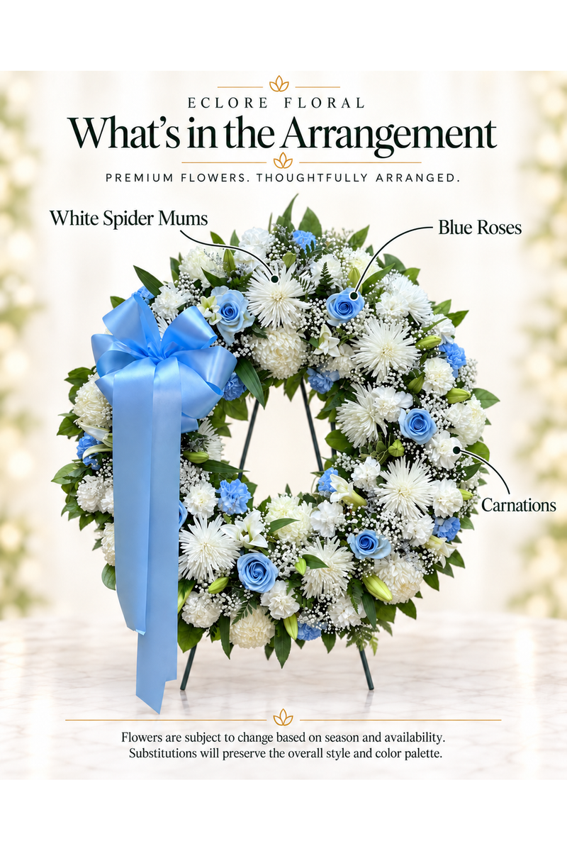 Eclore Floral — What’s in the Arrangement: White & Blue Sympathy Wreath. Flowers may vary with season and availability.