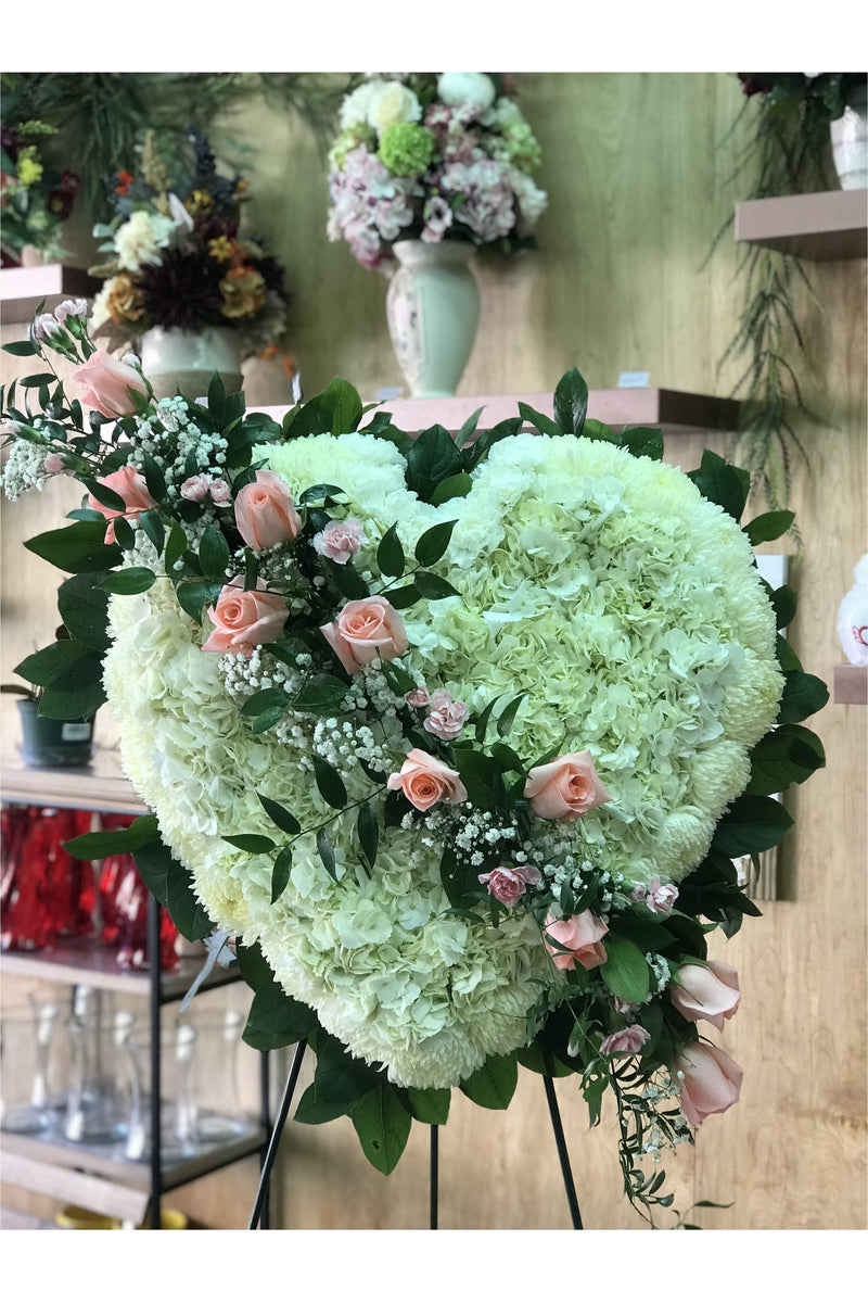 Full heart standing spray with white hydrangeas and blush roses for funeral service – Eclore Floral