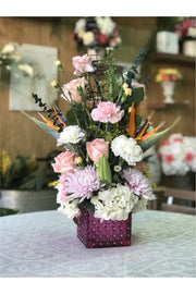 Pink berry floral arrangement with hydrangeas, roses, carnations, and Birds of Paradise in a pink vase – New Jersey florist.