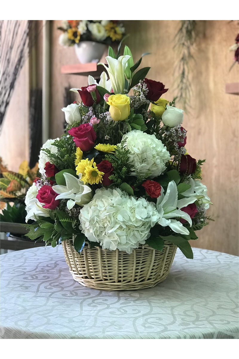 Large mixed flower basket with roses, lilies, daisies, and hydrangeas – handcrafted by New Jersey florist.