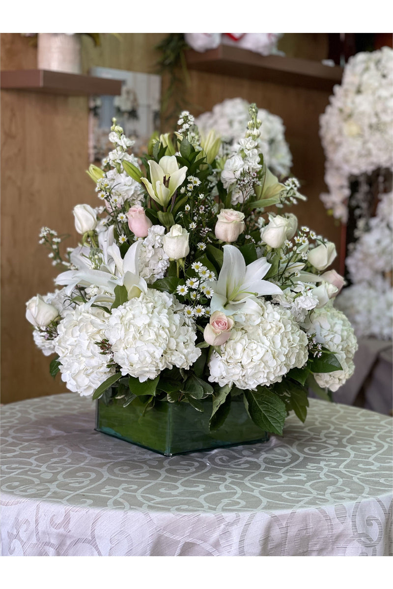 White Herbs Sympathy Arrangement – White Hydrangeas, Lilies & Roses
