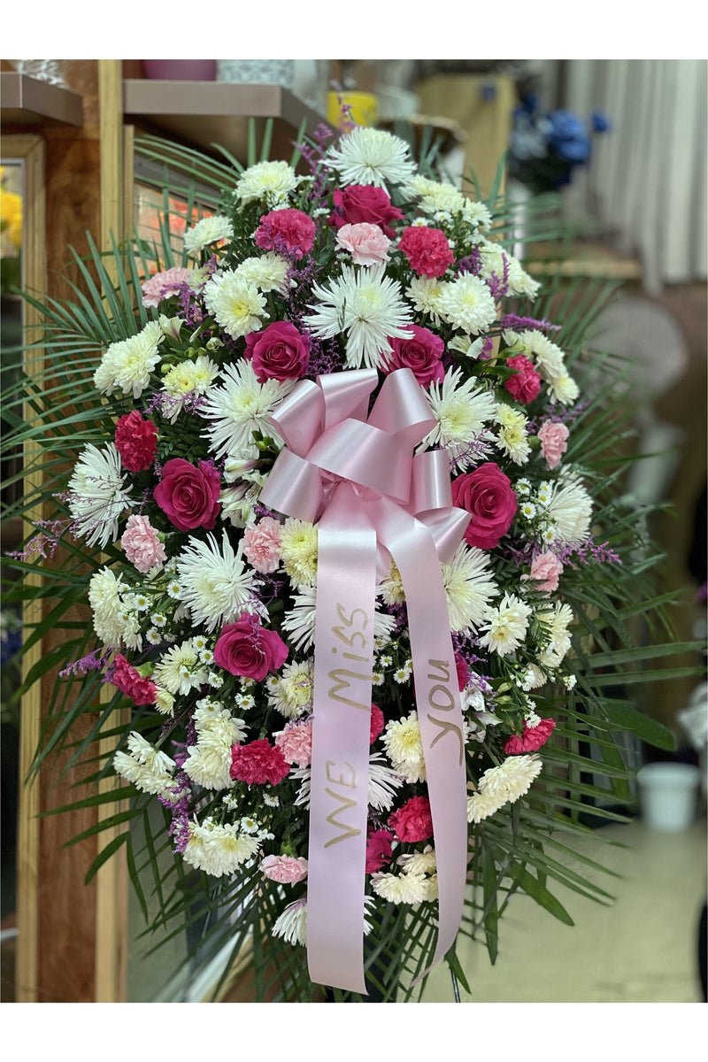 Pink and white standing spray with roses, carnations, and chrysanthemums — handcrafted by Eclore Floral in Hackensack, NJ